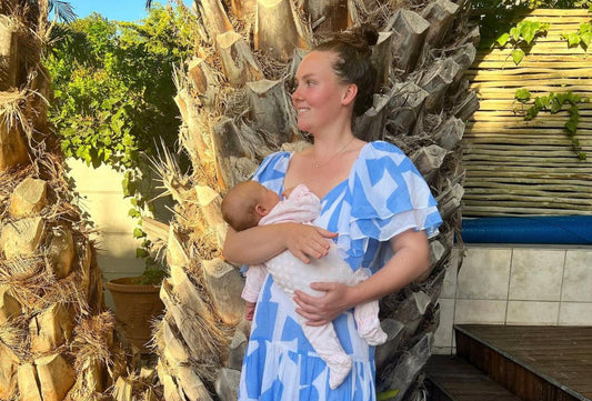 Photo of Gabriella breastfeeding her daughter