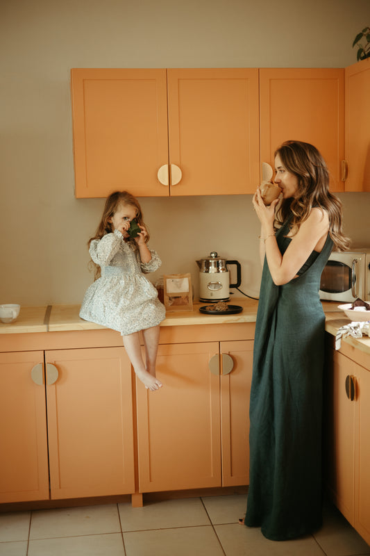 Image of a mother in the kitchen with her daughter